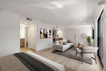 A modern living room with a white couch and sofa